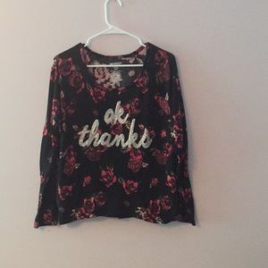 Long sleeve rose covered shirt with writing